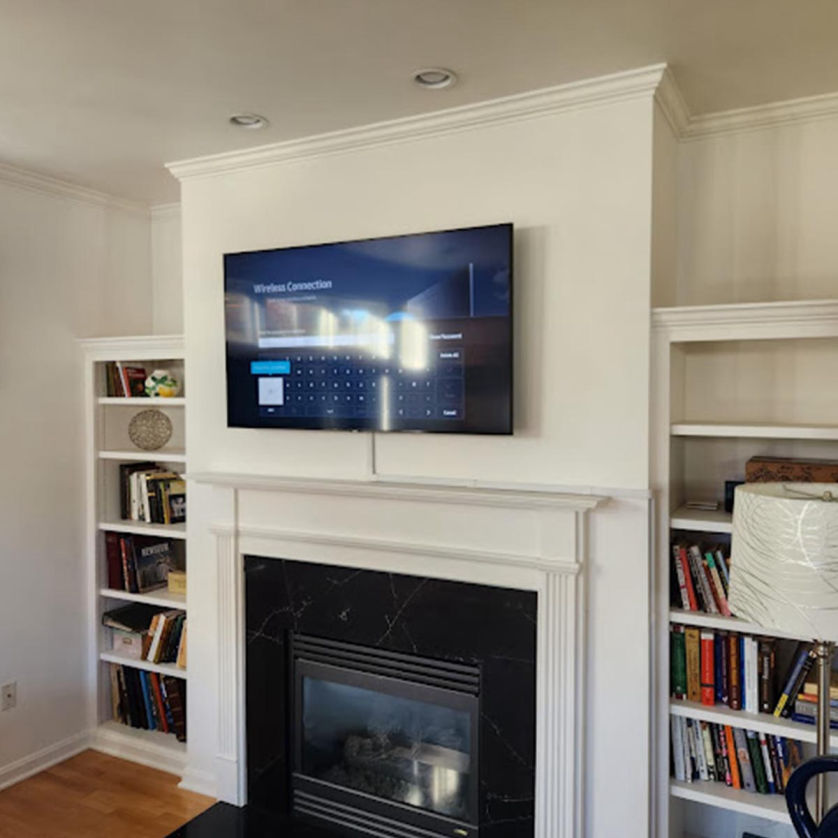 TV mounted over a fireplace