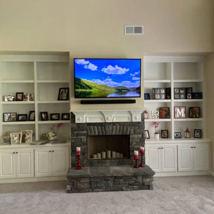 Image of a mounted TV in a living room.