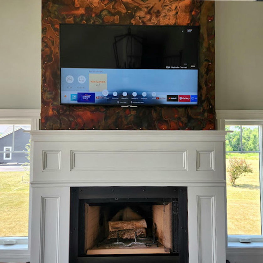 TV mounted over a fireplace